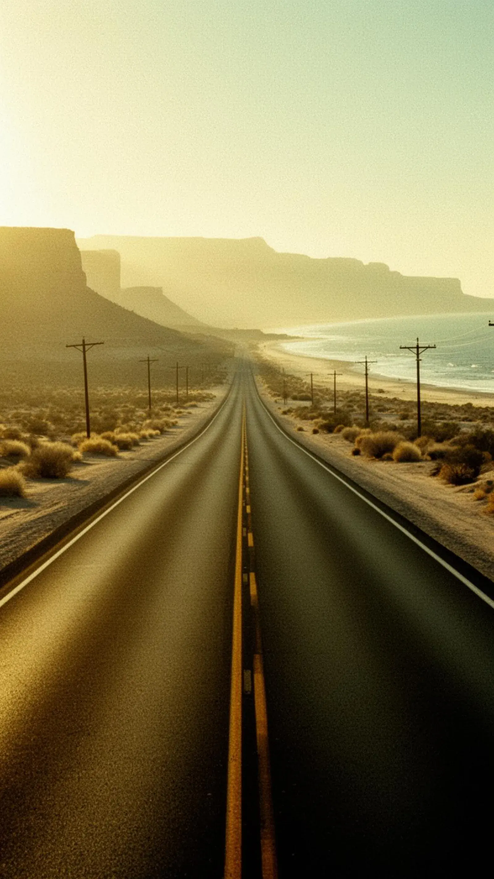 An empty highway where desert meets coast